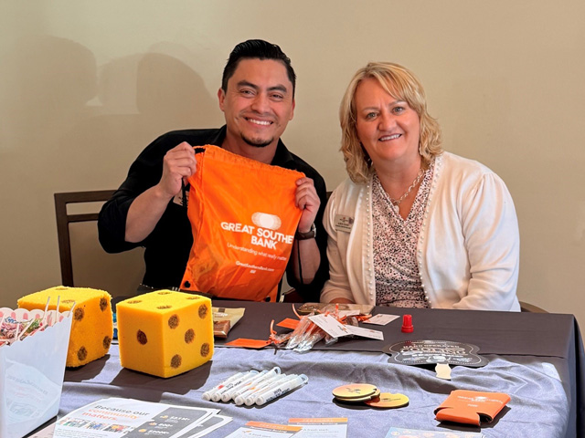Two Great Southern associates at an information booth.